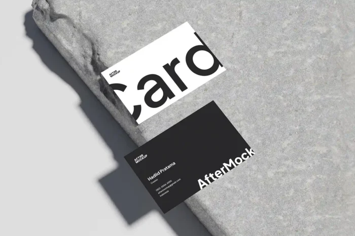 Business card mockup on concrete background for professional brand presentations.