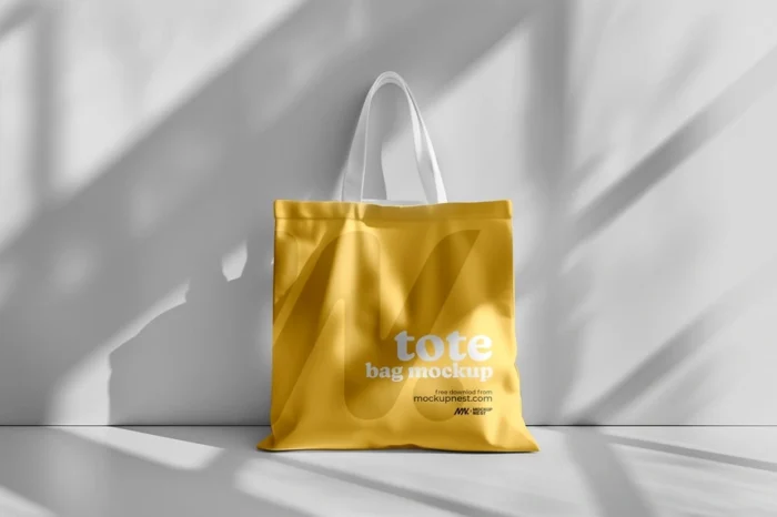 Free tote bag mockup PSD with smart object layers and realistic customizable presentation