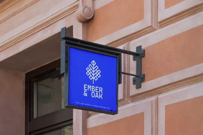 Free square wall-mounted shop logo mockup for realistic branding and storefront presentations.