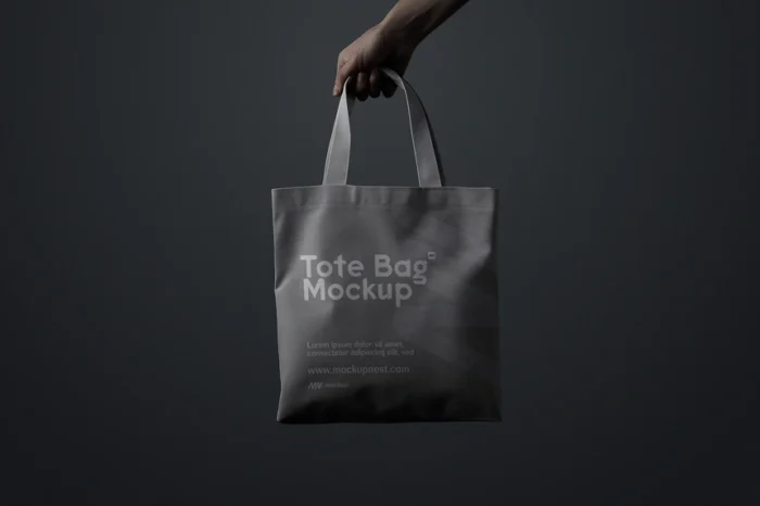 Free tote bag mockup holding PSD with customizable colors and realistic scene presentation