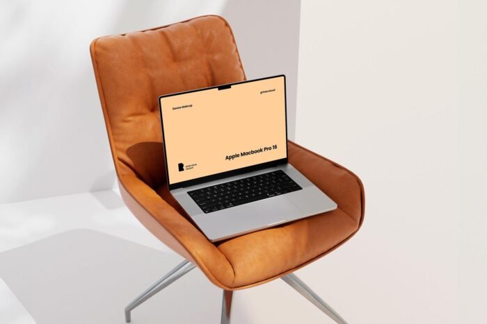Free Chair MacBook Pro Mockup PSD for UI/UX, branding, and website design presentations.