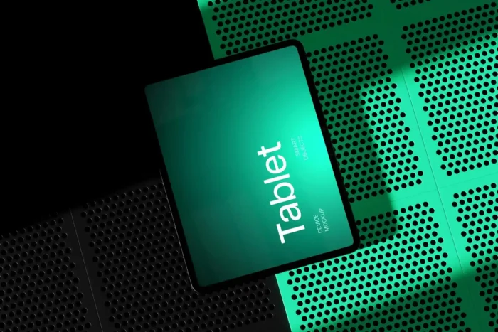 M4 iPad Pro 13 mockup in landscape orientation with glowing green screen on a perforated surface, perfect for showcasing UI or app design.