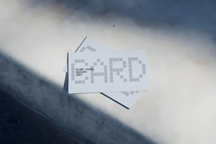 Free business card mockup with natural light and realistic soft shadows in PSD format