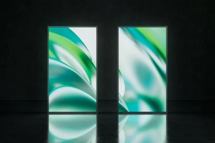 Vertical 9:16 screen mockup with glowing green and blue abstract design in a dark modern environment