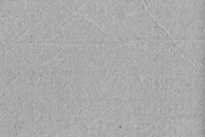 High-resolution halftone cardboard texture with natural creases and rough edges for design use