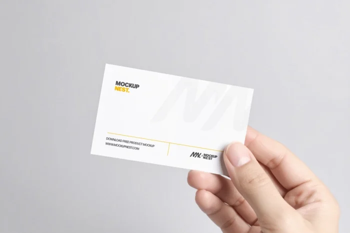 Hand holding business card mockup, PSD format, photorealistic and easy to edit with smart objects.