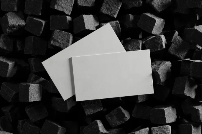 Realistic business card mockup on textured background