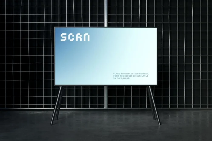 Free industrial TV screen mockup PSD with metal grid backdrop