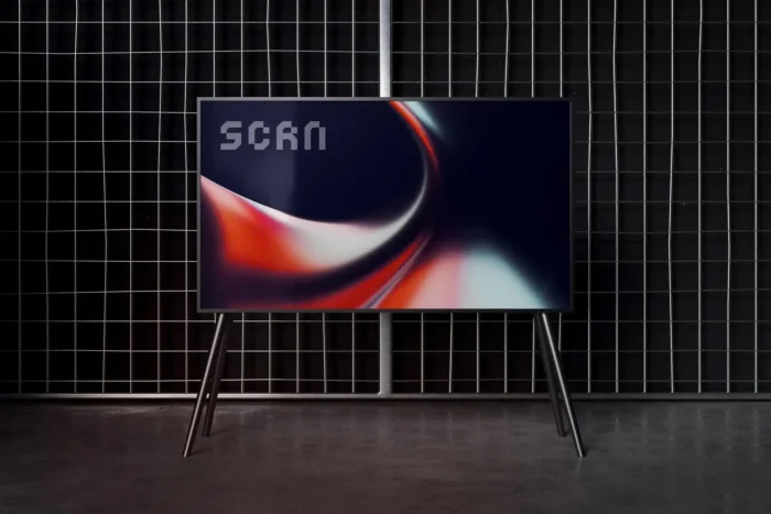 Editable TV screen mockup in urban industrial setting