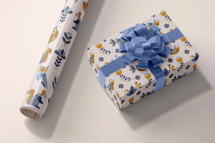 Realistic wrapping paper and box mockup PSD for showcasing holiday, branding, and product packaging designs.