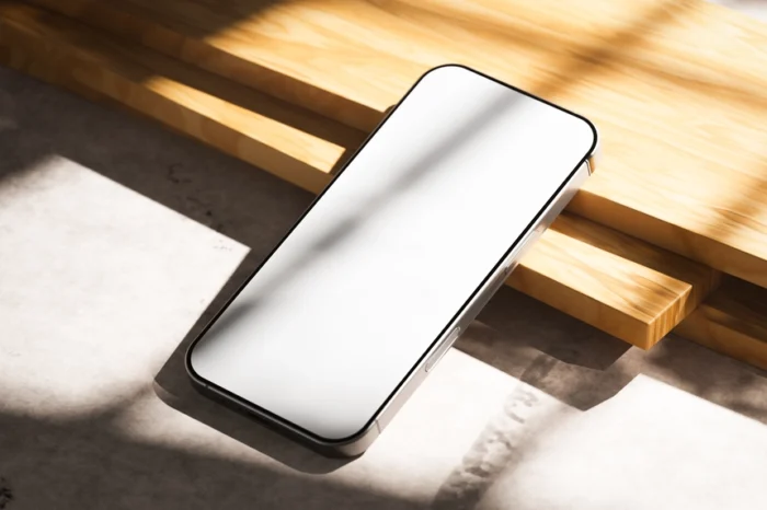 Free iPhone 16 Pro Mockup PSDT on Wooden Table