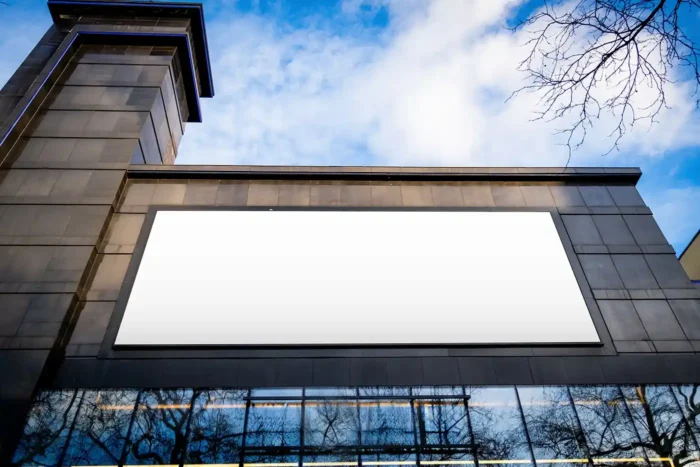 Free Billboard on Black Building Mockup PSD