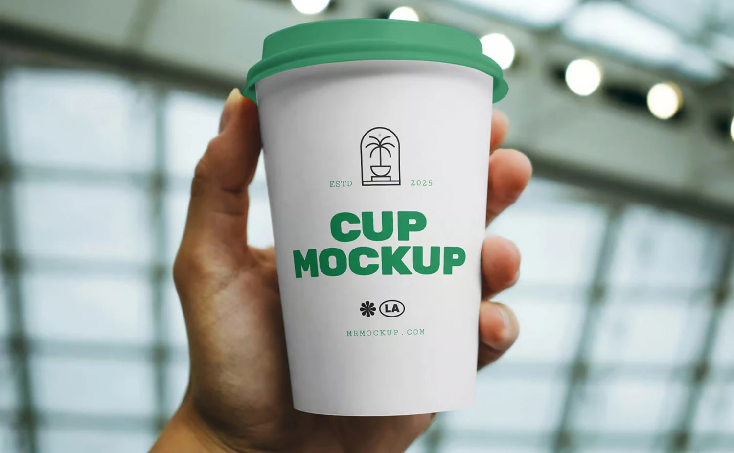 Free Outdoor Coffee Cup in Hand Mockup